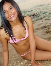 Beautiful Thai Coed Lee shows off on the beach before sex at hotel