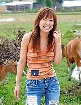 Japanese model shows her body off nude and clothed in country photos